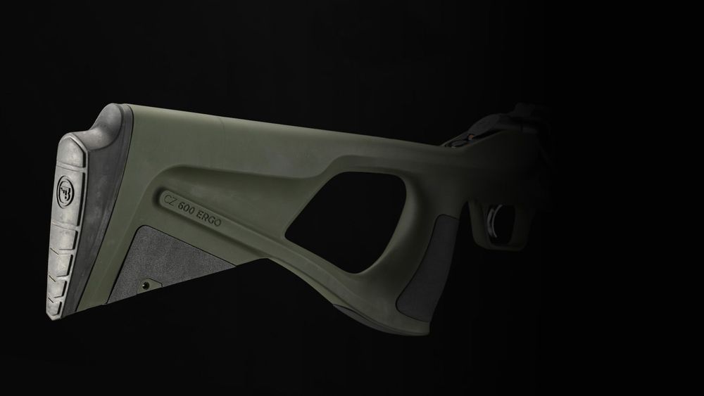 Thumbhole polymer stock with soft grip and replaceable cheek piece